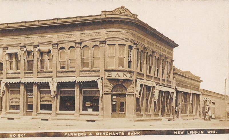 New Lisbon WI~Farmers & Merchants Bank Corner~Law Office~Barber Shop~c1908 RPPC 