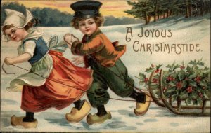 Christmas Little Dutch Boy and Girl with Sled c1910 Vintage Postcard