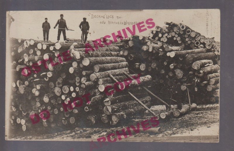 Wausau WISCONSIN RPPC 1925 LOGGING SCENE Lumberjacks DECKING LOGS Colby Photo WI