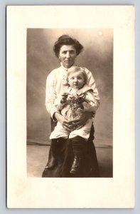 RPPC Young Boy in Boots in Mother's Lap AZO 1904-1918 ANTIQUE Postcard 1403