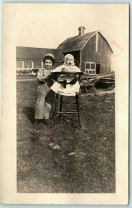 c1910s ID'd Baby & Little Boy Outside RPPC Real Photo Barn Postcard VanDusen A45 