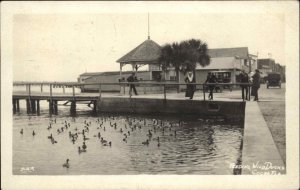 Cocoa FL Feeding The Ducks Town Buildings Used 1920 Real Photo Postcard