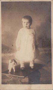 RPPC Postcard Little Girl On Table + Stuffed Toy Dog