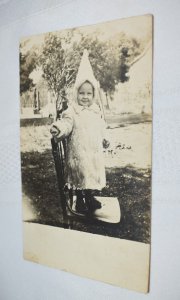 Child in Winter Attire Standing on Chair Real Photo Postcard