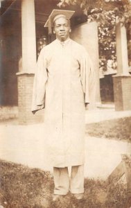 RPPC MAN GRADUATION GOWN BLACK AMERICANA REAL PHOTO POSTCARD (c. 1930s)