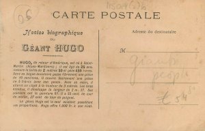 The giant Hugo offers 1000 francs to his rival tallest man world record postcard