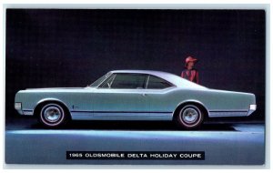 c1965 1965 Oldsmobile Delta Holiday Coupe V-8 Engine Lansing Michigan Postcard