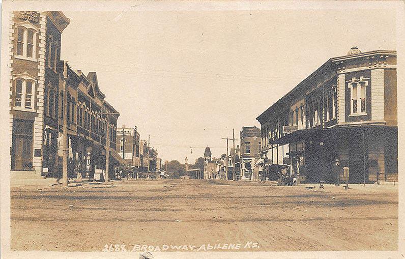 Abilene KS Dirt Street View Store Fronts Barber Shop RPPC Postcard