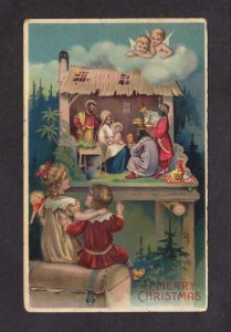 A Merry Christmas Greetings Children Manger Scene Embossed 1909 Postcard