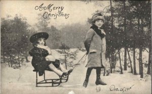 Christmas Children Sledding Winter Snow c1900s-20s Postcard