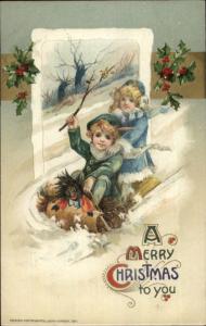 John Winsch Christmas  - Children Sled Black Doll c1910 Embossed Postcard