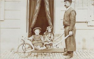 RPPC, Laborer Hauling His Kids in a Cart, L@@K!,Old Postcard