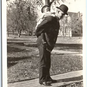 c1900s UDB Man Piggyback Ride Son SHARP RPPC Little Boy Real Photo PC House A185