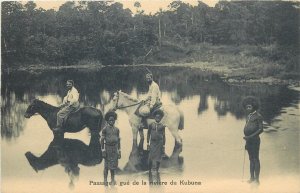 Papua New Guinea missionary fording crossing the Kubuna River vintage postcard 