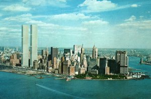 CONTINENTAL SIZE POSTCARD AERIAL VIEW OF LOWER MANHATTAN WITH FORMER TWIN TOWERS