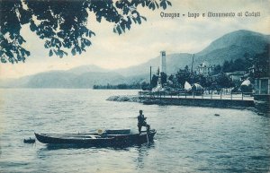 ITALY Omegna lake and monument Caduri rowboat