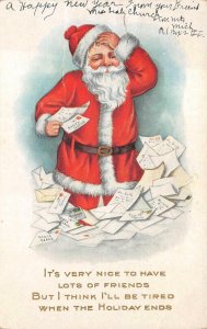 CHRISTMAS HOLIDAY SANTA CLAUS OVERWHELMED WITH LETTERS FAN MAIL POSTCARD 1916