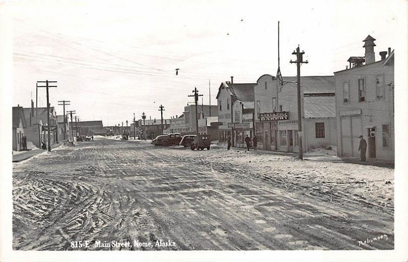 Nome AK Dirt Main Street Store Fronts North Pole Bakery  RPPC Postcard