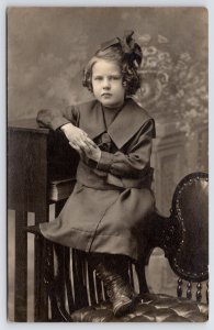 RPPC Poised Girl w/Ringlet Curls Rests Arm on Mission-Style Posing Book Table~PC