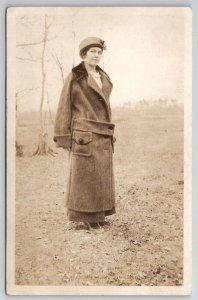 RPPC Lovely Woman Long Wool Coat Hat Looking Side Eye Real Photo Postcard H30