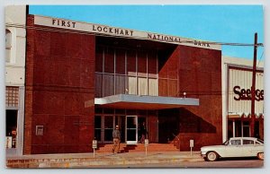 Lockhart Texas~First Lockhart National Bank~Customer on Steps~1950s Car~Postcard