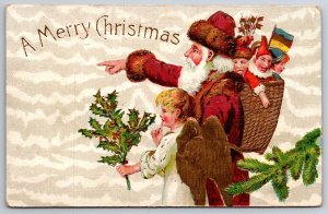 Christmas~Santa~Red Coat~Brown Fur~Directs Angel~Gold Wings~Emboss~Germany~1910