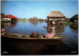 VINTAGE CONTINENTAL SIZED POSTCARD STILT HOMES AT GANVIE BENIN AFRICA STAMPS++