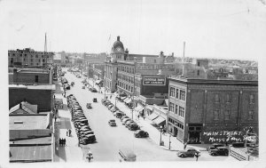 J80/ Moose Jaw Sask. Canada RPPC Postcard c1940s Main Street Stores 15