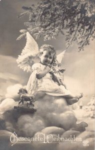 Germany 1926 Christmas Angel Holds Horse Toy Doll on Cloud Photo Montag postcard