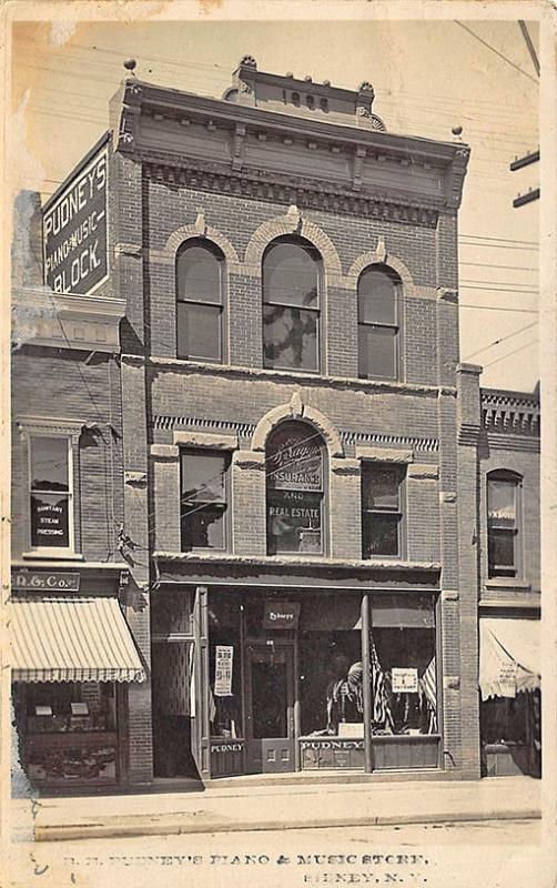 R. E. Pudney's Piano & Music Store RPPC Postcard 