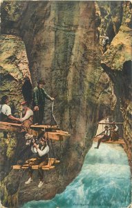 Postcard Switzerland Alps mountain man suspended hights