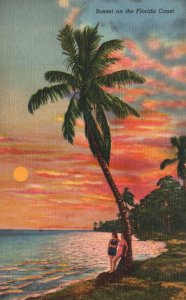 Vintage Postcard 1939 Sunset on the Florida Coast Two Women Under Coconut Tree