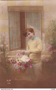 RP;  Young boy carrying gift basket of flowers, 1900-10s