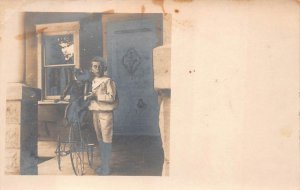 RPPC CHILD WITH BICYCLE & LARGE STEIFF TEDDY BEAR REAL PHOTO POSTCARD (c. 1910)