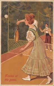 Novice at the Game Woman and Man Playing Tennis Tennis Writing on Back 