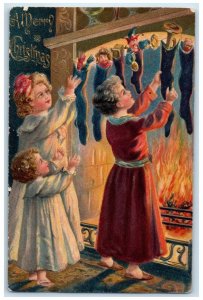 1907 Christmas Girls Stockings Full Of Toys Fireplace Embossed Antique Postcard