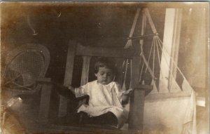 RPPC Child Napping on the Porch in Chair Real Photo c1910 Postcard U5