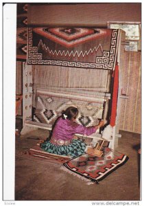 NEW MEXICO, 1940-1960's; Navajo Woman Weaving A Rug