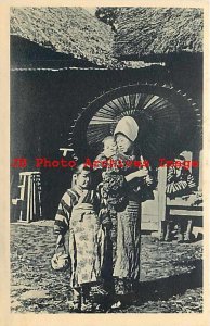 Japan, Children in Ethnic Folklore Costume Bringing Green Tea to their Father