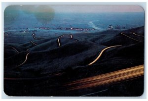 Lewiston Idaho ID Postcard Lewiston Hill Dusk Car Lights Tortuous Exterior c1965