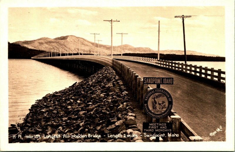 RPPC Sandpoint Idaho ID World's Longest All-Wooden Bridge NFBP Sign Postcard