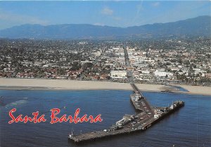 Lot 13 usa california santa barbara with stearns wharf in foreground car