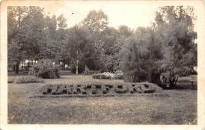 Hartford Michigan~Gardens in Park~RPPC Mailed 1944 to Soldier (James Galbreath)