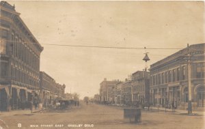 J10/ Greeley Colorado RPPC Postcard c1910  Main Street East Stores 230