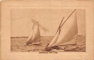 Sail boats  in Race Crossing the finish Line