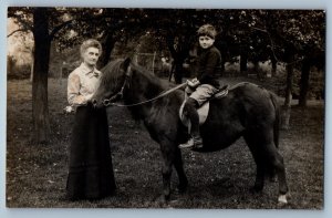 c1905 Mother And Son Riding Horse Scene Field RPPC Photo Antique Postcard