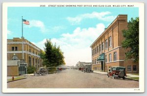 Miles City MT~Main St~US Flag Flies Over the Post Office~Elks Club~1920s Cars PC