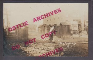 Elkton SOUTH DAKOTA RPPC 1913 HALLOWEEN PRANK Main Street OUTHOUSES!! Add On SD