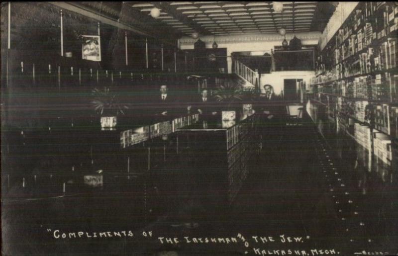 Judaica - Kalkaska MI Store Interior IRISHMAN & THE JEW c1910 RPPC Postcard