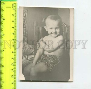 452168 USSR Cheerful child on a chair Old photo